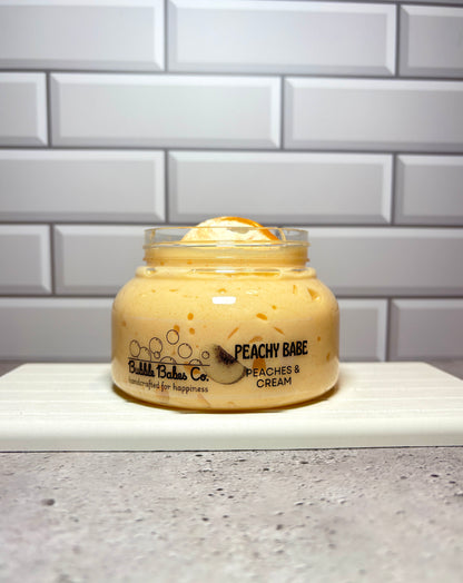 Jar of 'Peachy Babe' cream on a countertop with a tiled wall background